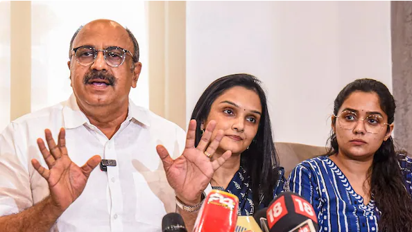 Siddique with actors Jomol and Ananya addresses the media on the Justice Hema Committee report, in Kochi, August 23, 2024.