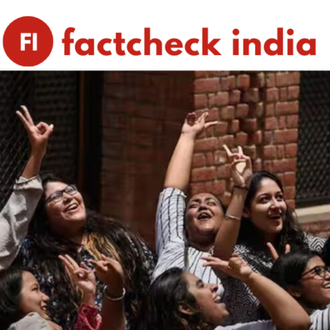 A group of happy students checking their results on a phone or computer